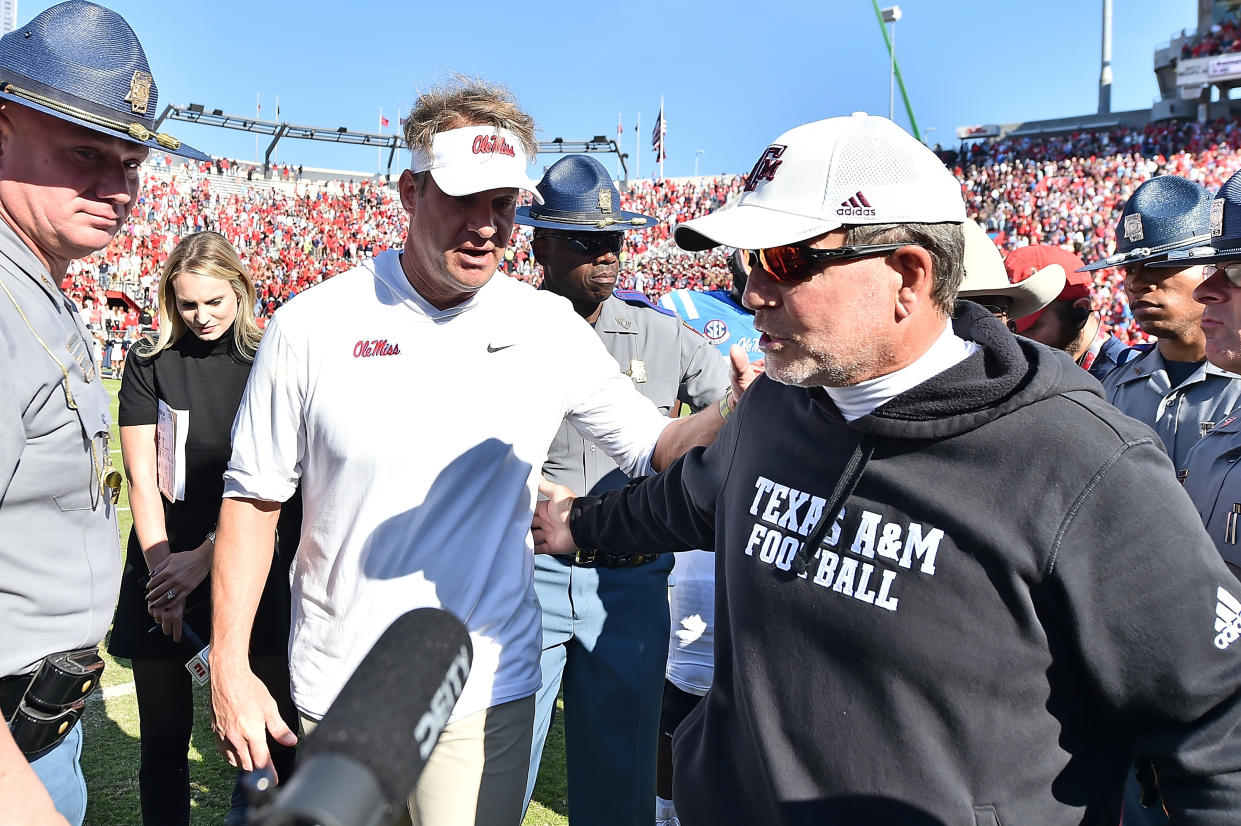 OXFORD, MISSISSIPPI - NOVEMBER 04: head coach Lane Kiffin of the Mississippi Rebels  and head coach Jimbo Fisher of the Texas A&M Aggies. after the game at Vaught-Hemingway Stadium on November 04, 2023 in Oxford, Mississippi. (Photo by Justin Ford/Getty Images)
