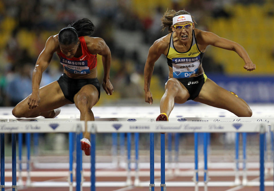 Virginia Powell-Crawford (L) and Lolo Jones of the US compete in the women's 100m hurdles at the IAAF Diamond League in Doha on May 6, 2011. AFP PHOTO/KARIM JAAFAR (Photo credit should read KARIM JAAFAR/AFP/Getty Images)