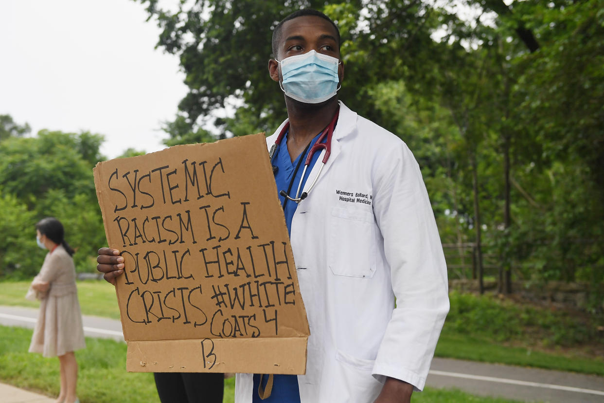 Several hundred doctors, nurses and medical professionals come together to protest police brutality on Friday. (Michael B. Thomas/Getty Images)