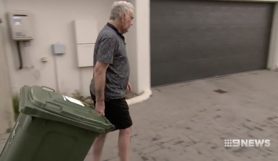 Pictured is Mr Willison taking out his bin at his Ellenbrook home.