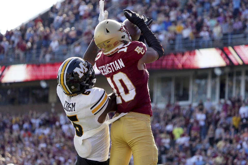 Boston College defensive back Brandon Sebastian (10) intercepts a pass intended for Missouri wide receiver Keke Chism (6) to win the game in the overtime period of an NCAA college football game, Saturday, Sept. 25, 2021, in Boston. (AP Photo/Mary Schwalm)