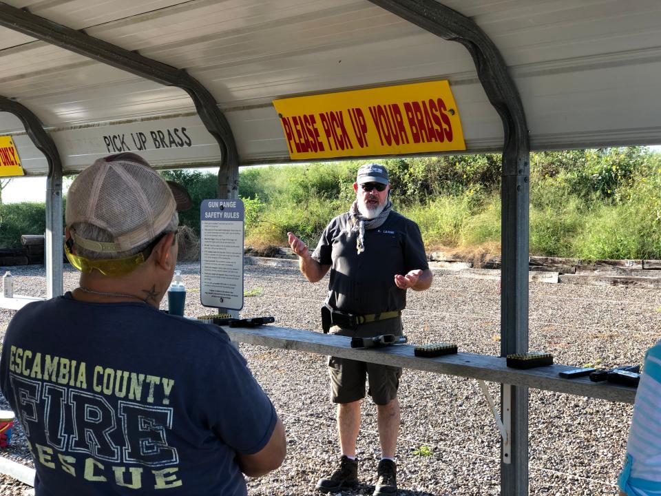 Kenneth Lease, owner of and licensed instructor at Hold The Line firearms training, speaks about range safety during a license to carry course at C&H Gun Range in Robstown on Sept. 11, 2021.