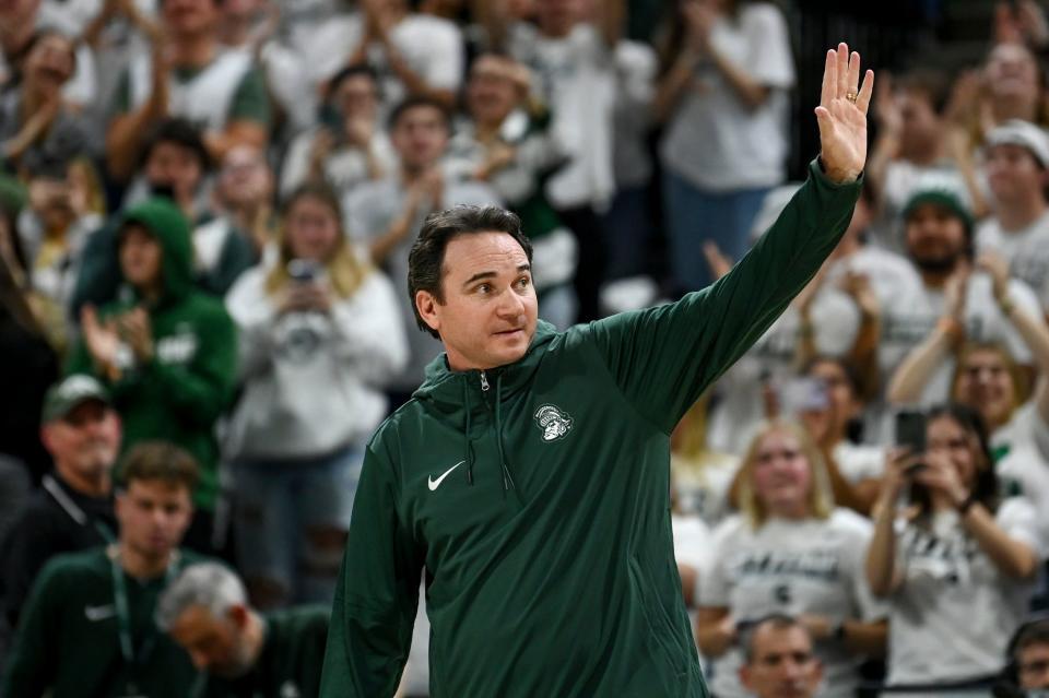 Michigan State’s new football coach Jonathan Smith waves to the crowd during a timeout in the basketball game against Georgia Southern on Tuesday, Nov. 28, 2023, at the Breslin Center in East Lansing. Nick King/Lansing State Journal-USA TODAY NETWORK