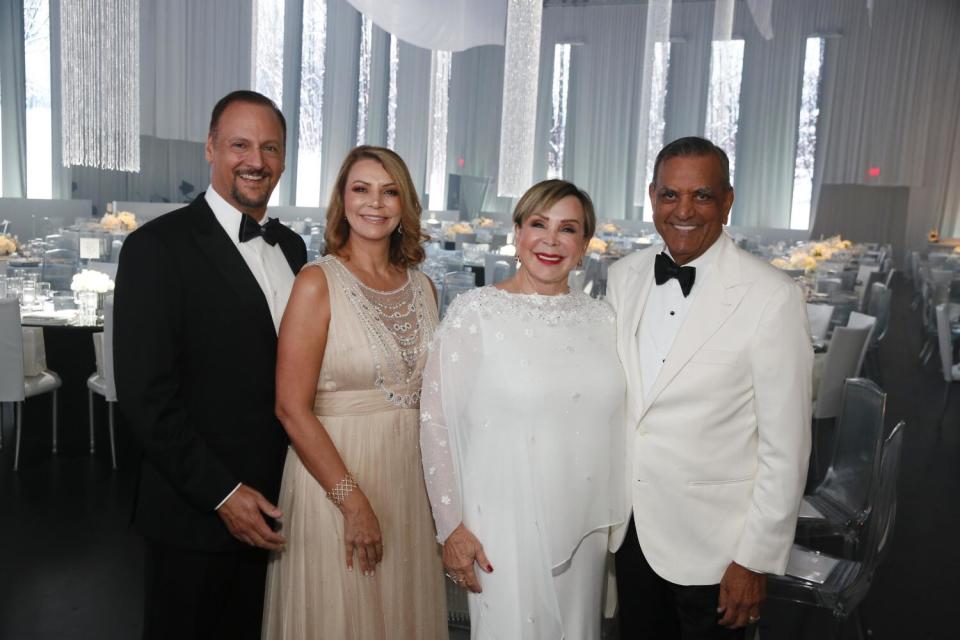 Richard Merage, left, Lisa Bhathal Merage, Marta Bhathal and Raj Bhathal attend the 46th annual Candlelight Concert.