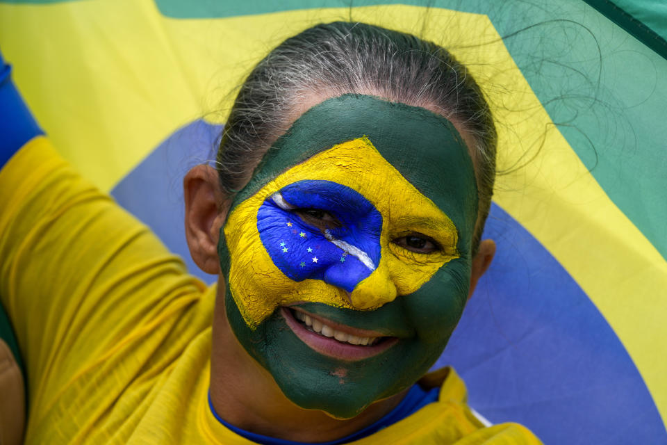 A supporter of Brazil's President Jair Bolsonaro attends a military parade commemorating the bicentennial of the country's independence in Brasilia, Brazil, Wednesday, Sept. 7, 2022. (AP Photo/Eraldo Peres)