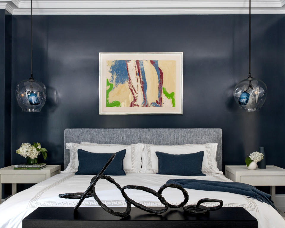 2. Place artwork above the bed