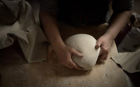 French baker Aurelie Ribay prepares bread dough on January 8, 2020 at her bakery in Paris. - Credit: PHILIPPE LOPEZ&nbsp;/AFP