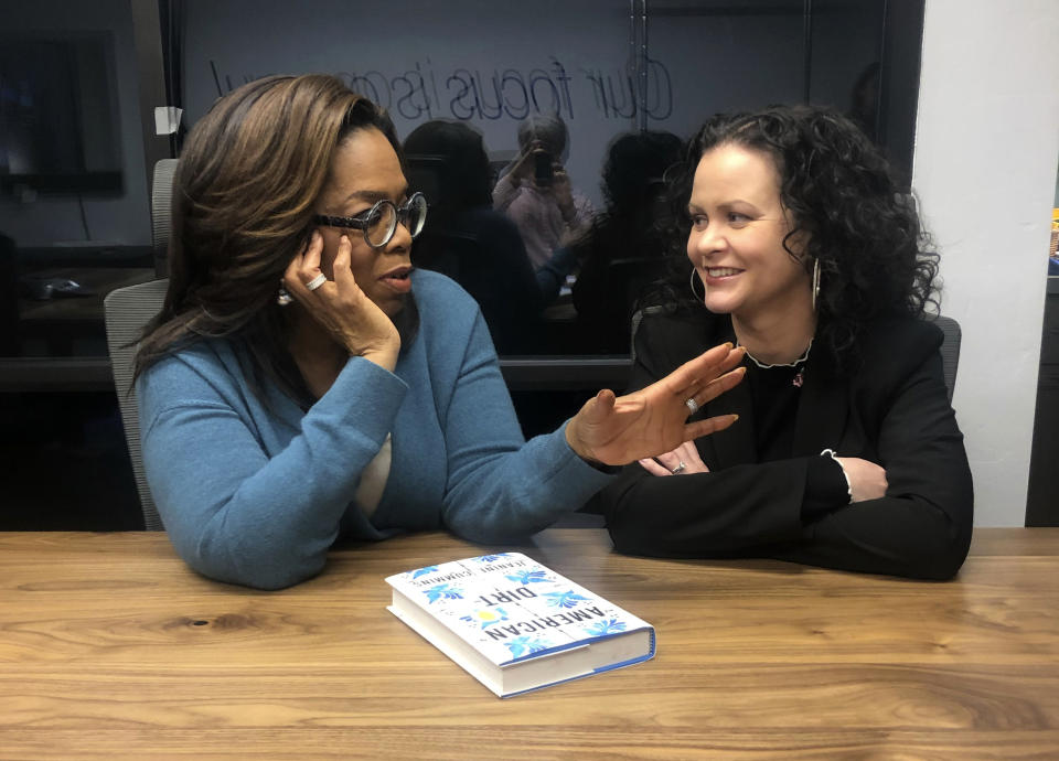 In this Feb. 13, 2020 photo, Oprah Winfrey, left, and “American Dirt" author Jeanine Cummins appear in a conference room just above Modern Studios in Tucson, Ariz., where they taped an Oprah's Book Club show about Cummins' controversial book. The two-part interview will begin streaming on Apple TV Plus at midnight ET on Friday, March 6. (AP Photo/Hillel Italie)