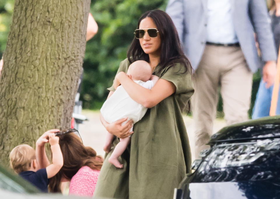 A photo of Meghan, Duchess of Sussex holding Archie Harrison Mountbatten-Windsor at The King Power Royal Charity Polo Day at Billingbear Polo Club on July 10, 2019 in Wokingham, England.