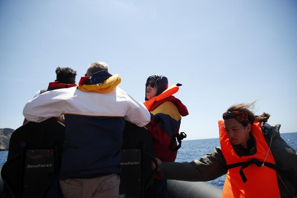 In this Monday, May 25, 2020 photo, medical staff in a speedboat crosses the Aegean Sea, Greece. Using dinghies, a GPS, and a portable refrigerator, state doctors have launched a COVID-19 testing drive on islands in the Aegean Sea ahead of the holiday season. The first round of testing was completed after trips to the islands of Milos, Kimolos, Folegandros, and Sikinos. (AP Photo/Thanassis Stavrakis)