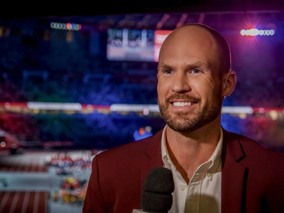 CBC Sports reporter Devin Heroux at the opening ceremony of the Tokyo Olympics in July. Heroux won't be on the ground in Beijing for next month's Winter Games because of residual virus from a positive COVID test last month. (Michel Aspirot/CBC - image credit)