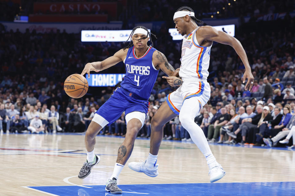 Feb 22, 2024; Oklahoma City, Oklahoma, USA; Oklahoma City Thunder guard Shai Gilgeous-Alexander (2) defends a drive by LA Clippers guard <a class="link " href="https://sports.yahoo.com/nba/players/6593/" data-i13n="sec:content-canvas;subsec:anchor_text;elm:context_link" data-ylk="slk:Brandon Boston Jr.;sec:content-canvas;subsec:anchor_text;elm:context_link;itc:0">Brandon Boston Jr.</a> (4) during the second half at Paycom Center. Mandatory Credit: Alonzo Adams-USA TODAY Sports