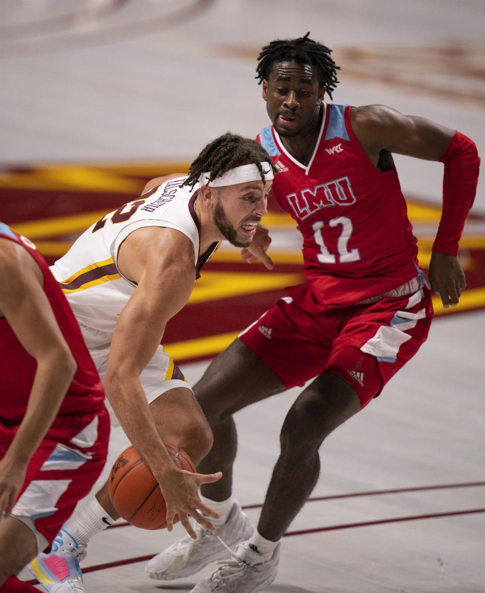 Minnesota guard Gabe Kalscheur (22) loses control of the ball while driving to the rim in the first half of an NCAA college basketball game against Loyola Marymount, Monday, Nov. 30, 2020, in Minneapolis. (Jeff Wheeler/Star Tribune via AP)