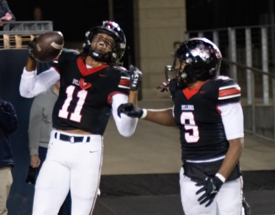 McKinley’s Keith Quincy celebrates his game-ending interception in the end zone to seal a playoff win over St. Ignatius on Friday, Nov. 3, 2023.