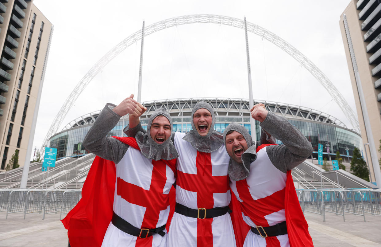 Fans of England dressed as Knights of St George outside Wembley Stadium