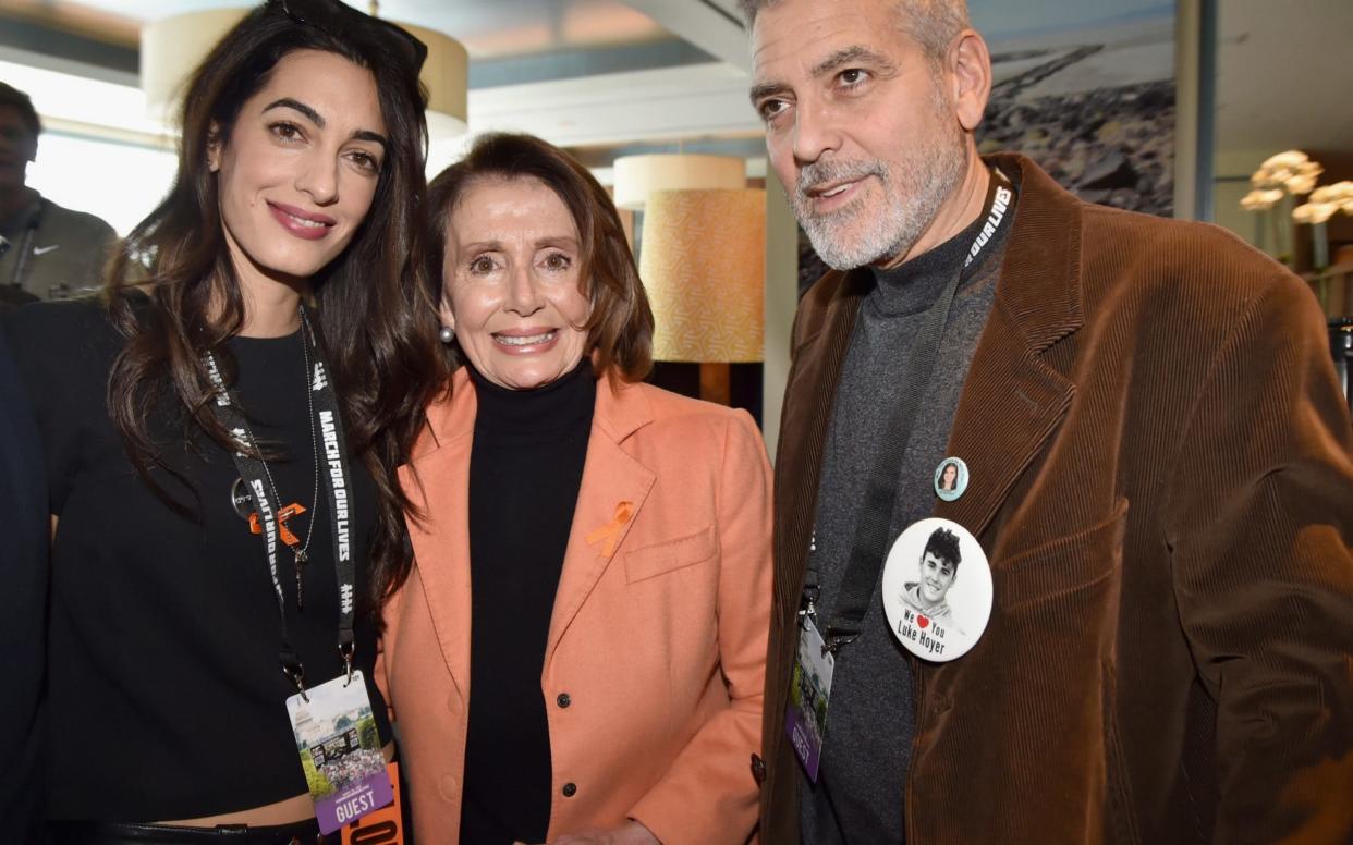 George Clooney, Congresswoman Nancy Pelosi, and Amal Clooney attend March For Our Lives on March 24, 2018 in Washington, DC.  - Getty Images North America