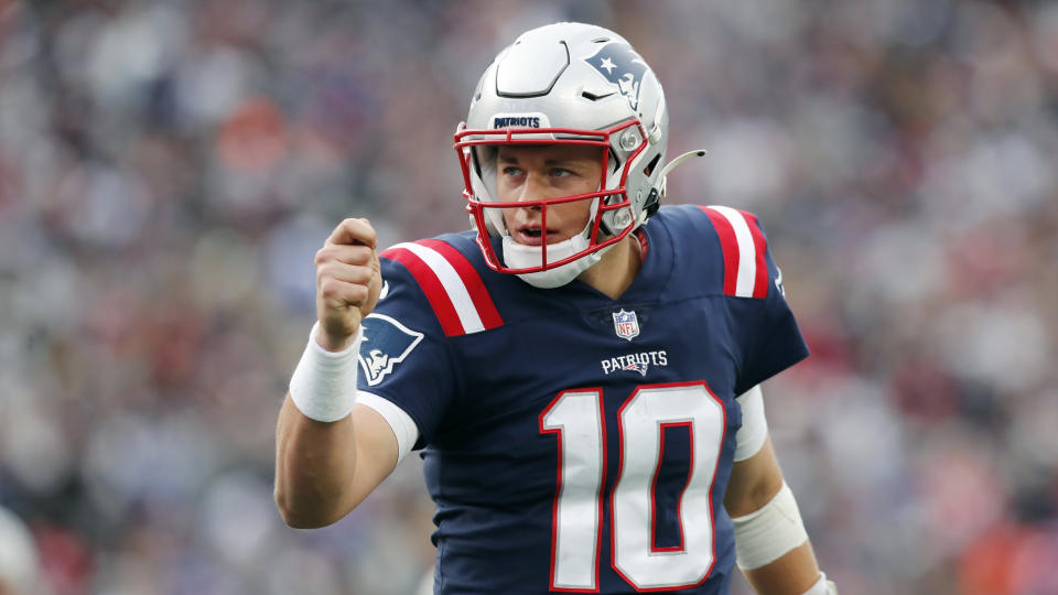 New England Patriots quarterback Mac Jones (10) celebrates after a touchdown by Rhamondre Stevenson during the second half of an NFL football game against the Cleveland Browns, Sunday, Nov. 14, 2021, in Foxborough, Mass. (AP Photo/Michael Dwyer)