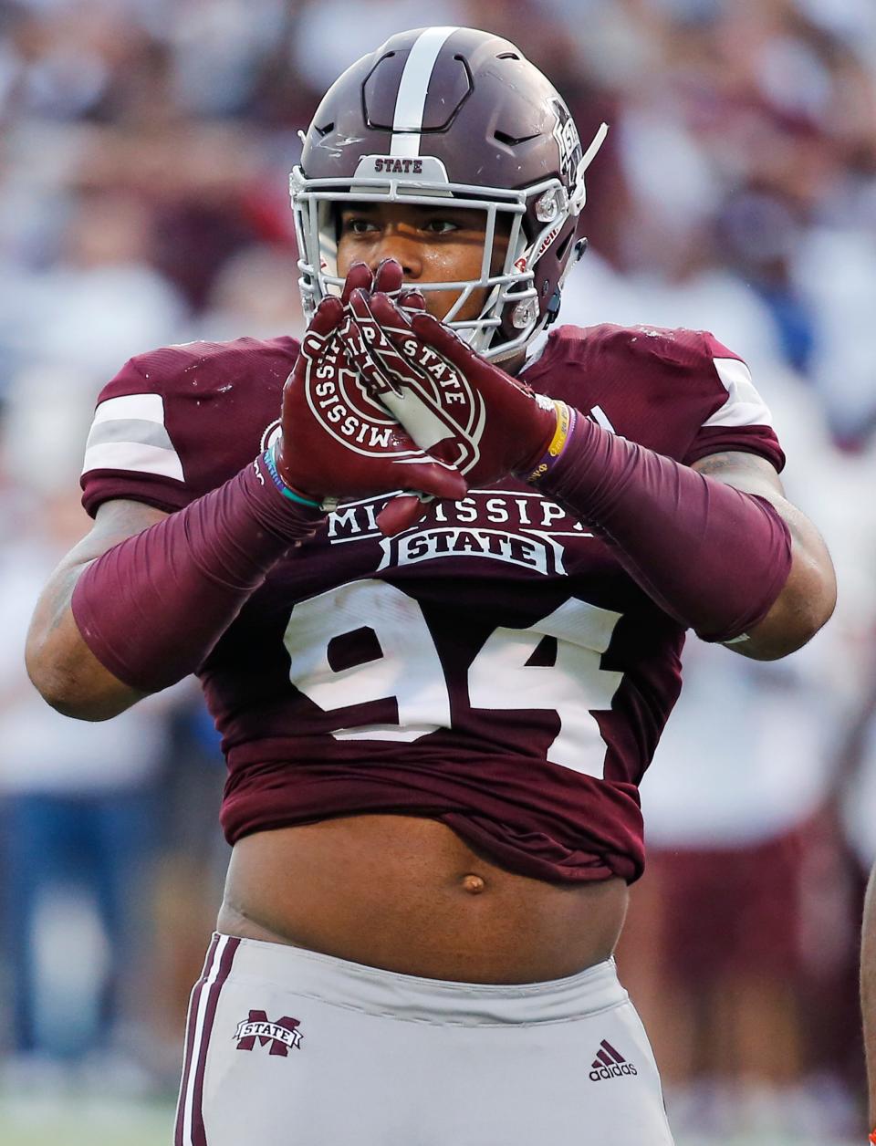 Jeffery Simmons (94) signs toward the Florida bench.