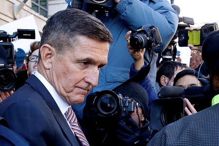 FILE PHOTO: Former U.S. national security adviser Michael Flynn passes by members of the media as he departs after his sentencing was delayed at U.S. District Court in Washington, U.S., December 18, 2018. REUTERS/Joshua Roberts/File Photo