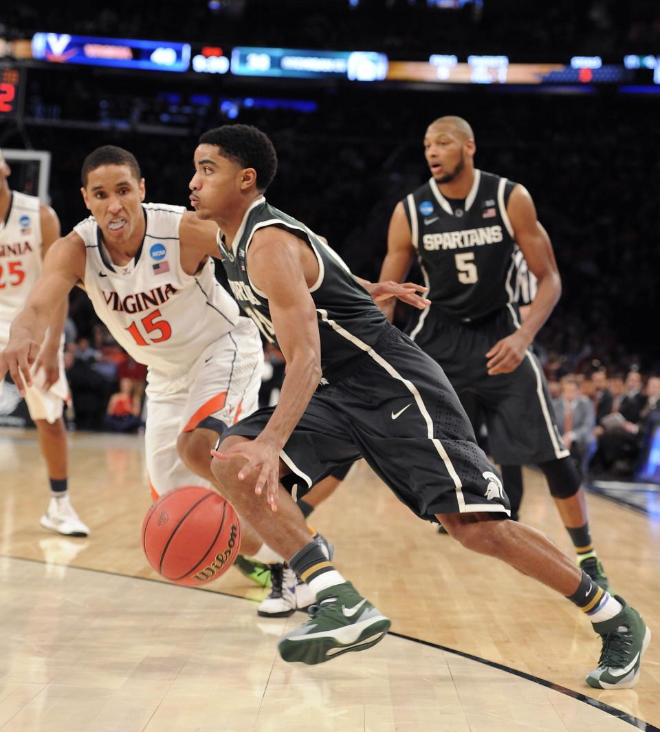MSU's Gary Harris drives  against Virginia's Malcolm Brogdon during their Sweet 16 on March 28, 2014 at Madison Square Garden. The fourth-seeded Spartans, beat top-seed Virginia, 61-59.