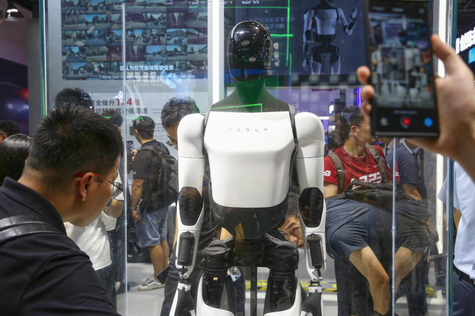 SHANGHAI, CHINA - JULY 05 2024: Visitors check out Tesla's second-generation Optimus humanoid robot exhibited at the World AI Conference in Shanghai. (Photo credit should read / Feature China/Future Publishing via Getty Images)