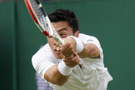 Brandon Nakashima of the US returns to Colombia's Daniel Elahi Galan during their men's third round singles match on day six of the Wimbledon tennis championships in London, Saturday, July 2, 2022. (AP Photo/Alberto Pezzali)