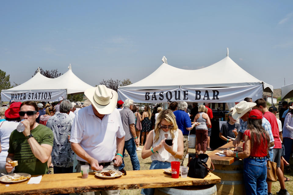 People attend the Morning in Nevada PAC's Basque Fry at Corley Ranch, Saturday, Aug. 14, 2021, in Gardnerville, Nev. U.S. Sen. Tom Cotton told a crowd of about 4,000 Nevada Republicans that Adam Laxalt planned to run for the U.S. Senate against Democrat Catherine Cortez Masto. (AP Photo/Sam Metz)