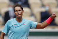 Spain's Rafael Nadal celebrates winning the second round match of the French Open tennis tournament against Mackenzie McDonald of the U.S. at the Roland Garros stadium in Paris, France, Wednesday, Sept. 30, 2020. (AP Photo/Christophe Ena)