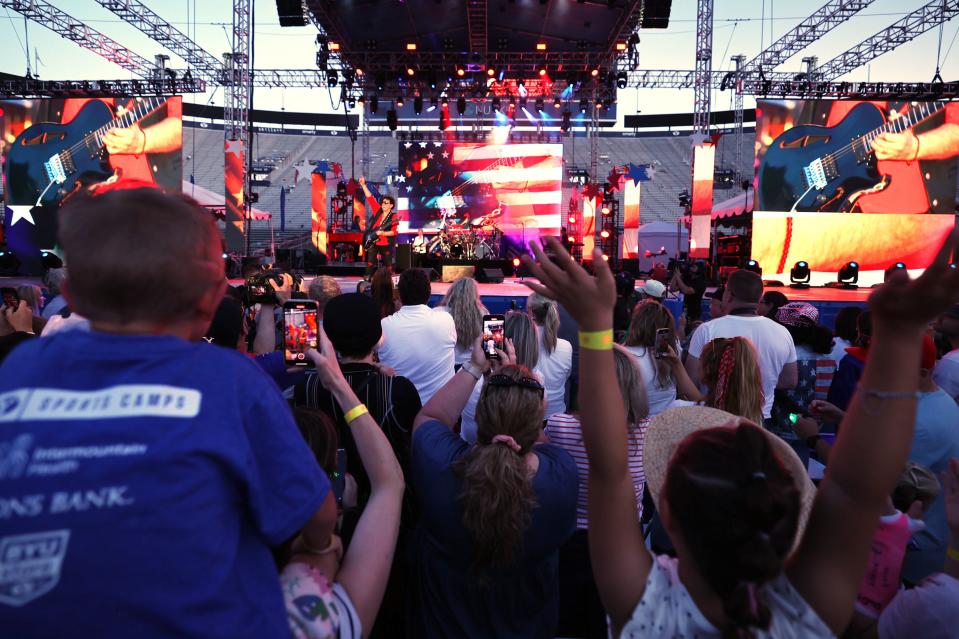 Fans cheer and sing along with Journey as they perform at the Stadium of Fire in Provo on Saturday, July 1, 2023. | Scott G Winterton, Deseret News