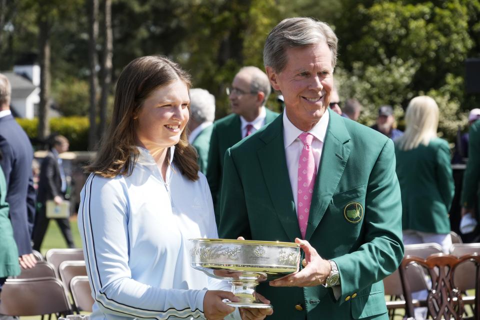 Apr 6, 2024; Augusta, Georgia, USA; Augusta National Chairman Fred Ridley and Lottie Woad pose for photos after a ceremony following the Augusta National Women's Amateur golf tournament at Augusta National Golf Club. Mandatory Credit: Michael Madrid-USA TODAY Sports