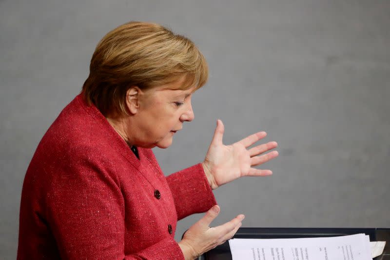 FILE PHOTO: German Chancellor Angela Merkel delivers a speech in parliament, in Berlin