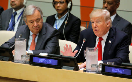 FILE PHOTO: U.N. Secretary General Antonio Guterres (L) watches as U.S. President Donald Trump speaks during a session on reforming the United Nations at U.N. Headquarters in New York, U.S., September 18, 2017. REUTERS/Lucas Jackson/File Photo