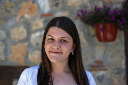 Emilija, who works as a receptionist in a hotel, poses for a for a portrait in on old part of Ohrid, Macedonia, June 4, 2018. Emilija expects "living standard to change for better once the country joins EU and NATO. Greeks come here as tourists and we are friends, I can say only good things about them. It is only politics that is causing trouble between people," she said. REUTERS/Marko Djurica SEARCH "DJURICA MACEDONIA" FOR THIS STORY. SEARCH "WIDER IMAGE" FOR ALL STORIES.