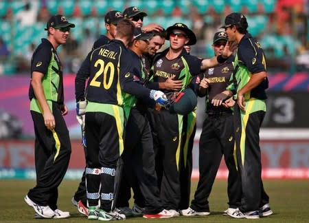 Cricket - Australia v New Zealand - World Twenty20 cricket tournament - Dharamsala, India, 18/03/2016. Australia's Glenn Maxwell (C) is congratulated by his teammates after taking the wicket of New Zealand's Corey Anderson. REUTERS/Adnan Abidi