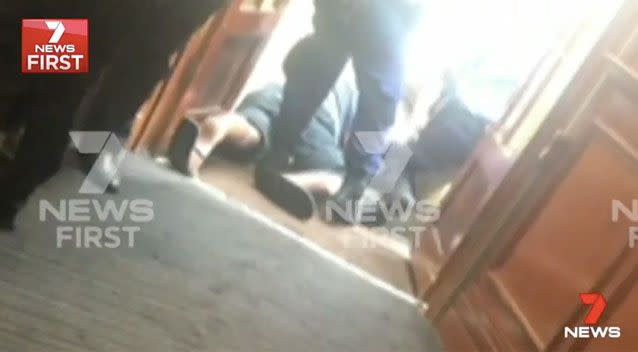 Newman (pictured here on the floor) was shot dead at Maroubra Junction Hotel on Anzac Parade after he stabbed a police officer at least twice. Source: 7 News