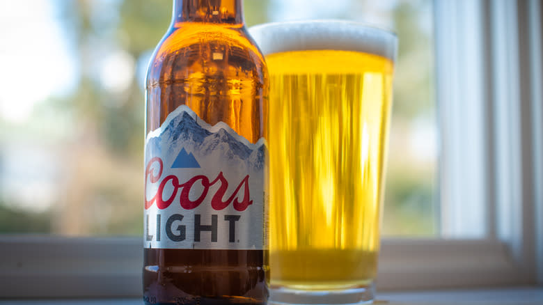 Bottle of Coors Light in glass