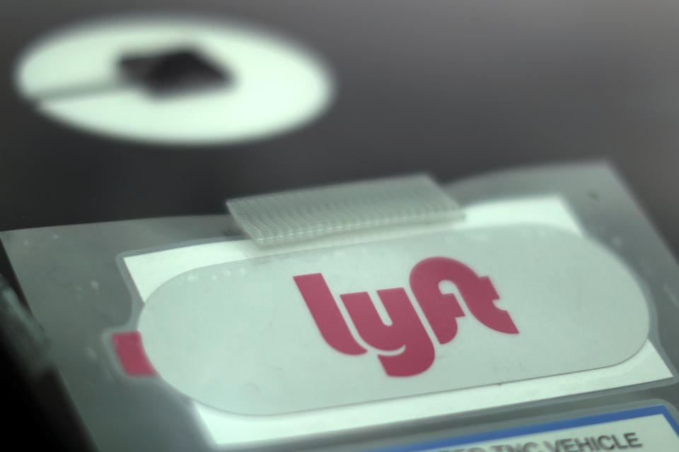 Uber and Lyft stickers are seen on a car windscreen as protesters join an Uber drivers' strike for higher wages at LAX airport in Los Angeles, California, U.S., May 8, 2019. REUTERS/Lucy Nicholson