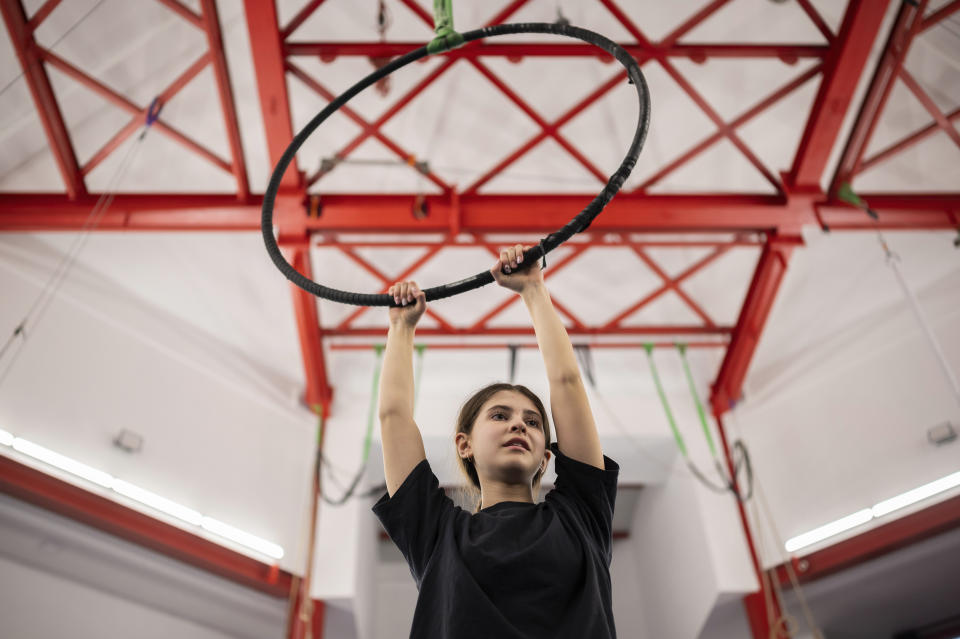 Ukrainian refugee circus student Anna Lysytska practicing in a training room in Budapest, Hungary, Monday, Feb. 13, 2023. More than 100 Ukrainian refugee circus students, between the ages of 5 and 20, found a home with the Capital Circus of Budapest after escaping the embattled cities of Kharkiv and Kyiv amid Russian bombings. (AP Photo/Denes Erdos)
