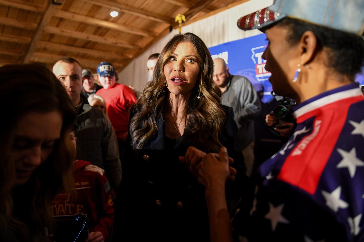 Gov. Kristi Noem socializes with attendees during a caucus event in support of Donald Trump on Wednesday, Jan. 3, 2024 at County Celebrations Center in Sioux City, Iowa.