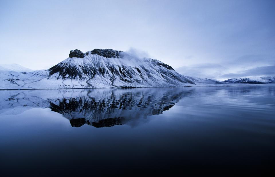 <h1 class="title">Mountain Reflection, Grise Fiord, Nunavut</h1><cite class="credit">Photo by Robert Postma. Image courtesy of Getty.</cite>