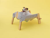 Here’s a secret about Jack Russell terriers: He’s happiest on his master’s clothes. “The smell and the feeling of the fabric set the dog at ease,” say designers at Torafu Architects who created the “Wanmock.” The architects explain, “We devised a piece of furniture for the dog to inhabit that would incorporate the master’s clothes.” (Photo by Hiroshi Yoda / <a href="http://www.architecturefordogs.com/" rel="nofollow noopener" target="_blank" data-ylk="slk:Architecture for Dogs;elm:context_link;itc:0;sec:content-canvas" class="link ">Architecture for Dogs</a>)