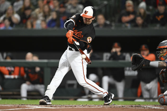Baltimore Orioles' Adley Rutschman connects for a single against the Houston Astros in the first inning of a baseball game, Friday, Sept. 23, 2022, in Baltimore. (AP Photo/Gail Burton)