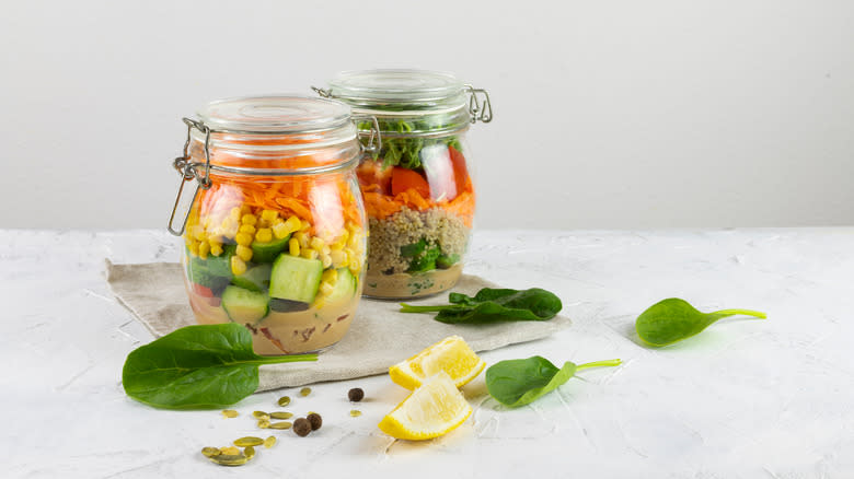 two prepped salads in mason jars