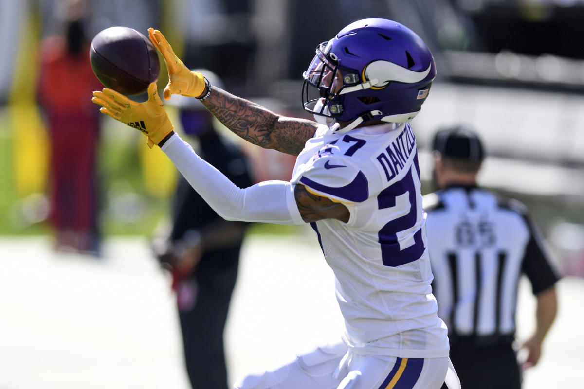 Minnesota Vikings cornerback Patrick Peterson (7) runs with the ball after  intercepting a pass during the first half of an NFL football game against  the Chicago Bears, Sunday, Jan. 8, 2023, in