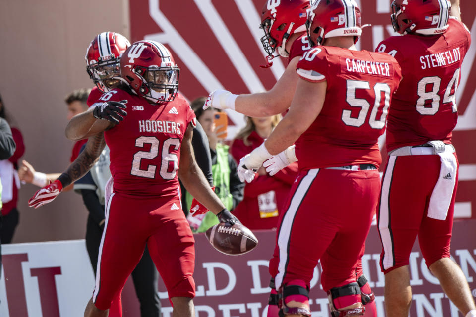 Indiana running back Josh Henderson (26) reacts after scoring during the first half of an NCAA college football game against Michigan, Saturday, Oct. 8, 2022, in Bloomington, Ind. (AP Photo/Doug McSchooler)