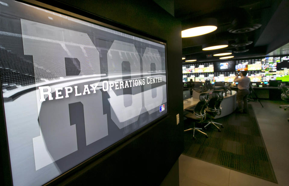 Banks of television screens line the walls of Major League Baseball's Replay Operations Center during a preview of the venue, in New York, Wednesday, March 26, 2014. Less than a week before most teams open, MLB is working on the unveiling of its new instant replay system, which it hopes will vastly reduce incorrect calls by umpires. (AP Photo/Richard Drew)
