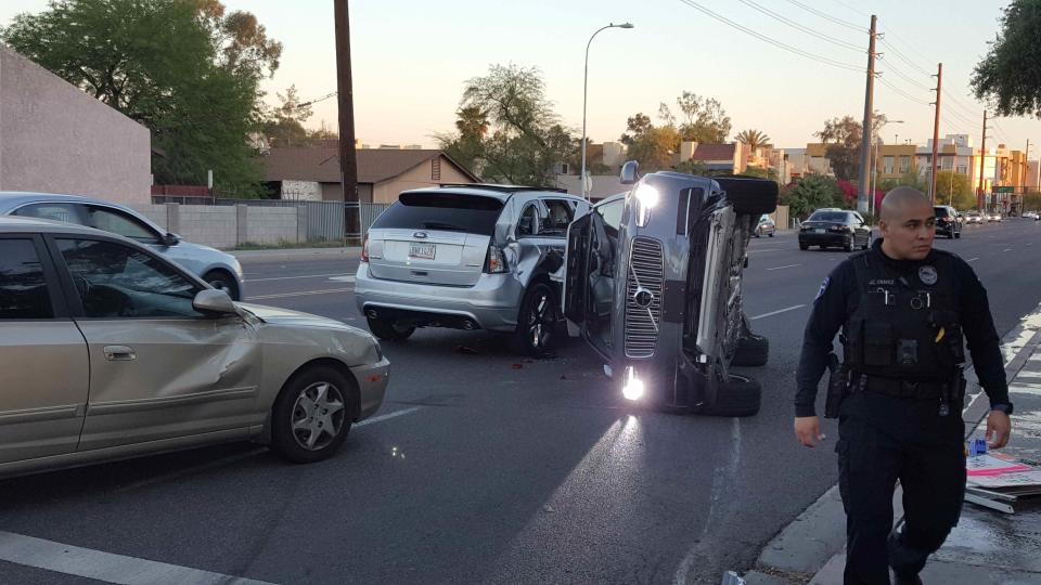 A self-driven Volvo SUV owned and operated by Uber is flipped on its side after a collision during testing in Tempe, Arizona, earlier this year (FRESCO NEWS/Reuters)