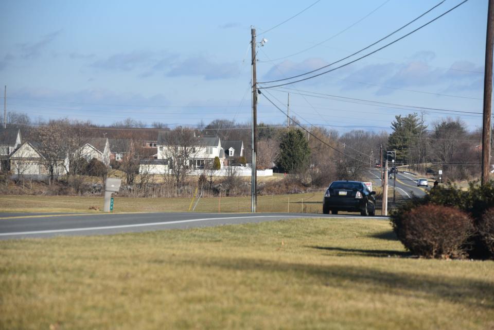 A 33-building apartment complex is proposed for a 70-acre property on Ragged Edge Road, Greene Township. In this photo, the complex would be built on the left side of the road.