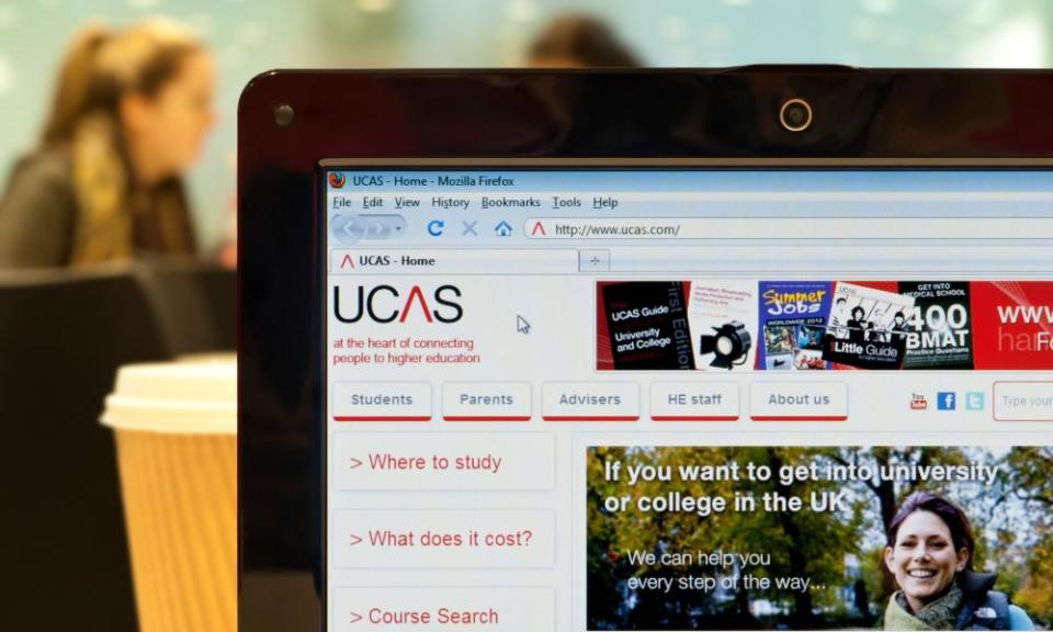 The UCAS website shot in a coffee shop environment