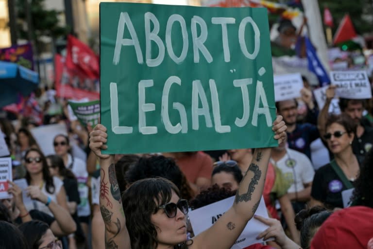 A woman holds a placard that reads "Legal abortion now" during a protest against an anti-abortion bill in Sao Paulo, Brazil, on June 15, 2024 (NELSON ALMEIDA)